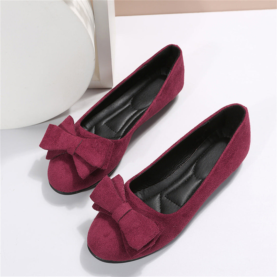 Paire de sandales rouge pour femme avec nœud sur l’avant, semelle souple et design féminin élégant