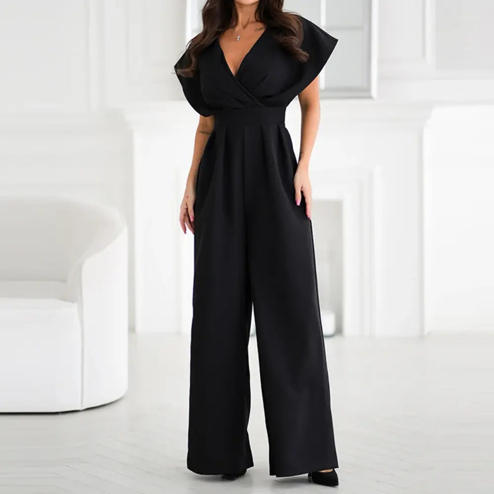 Combinaison élégante noir pour femme avec jambes larges, décolleté croisé et coupe fluide sophistiquée