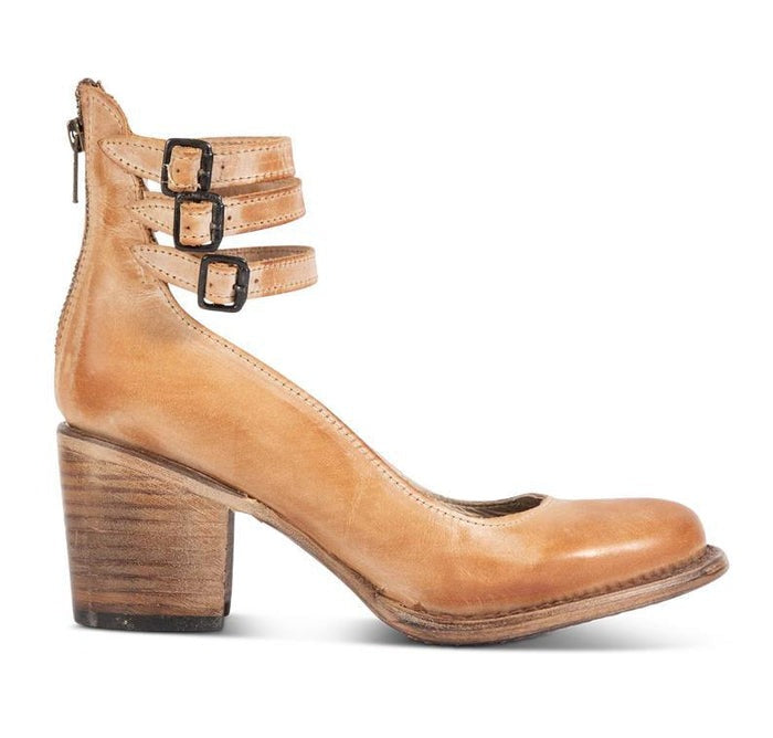 Vue latérale de bottines marron élégantes avec bout arrondi et talon épais sur fond neutre