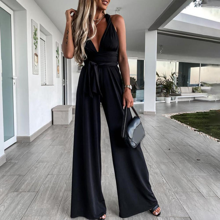 Combinaison noire élégante pour femme avec dos croisé, pantalon large et silhouette sophistiquée