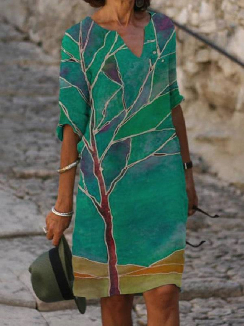 Robe élégante vert foncé pour femme avec grand motif de feuille, manches trois-quarts et coupe fluide