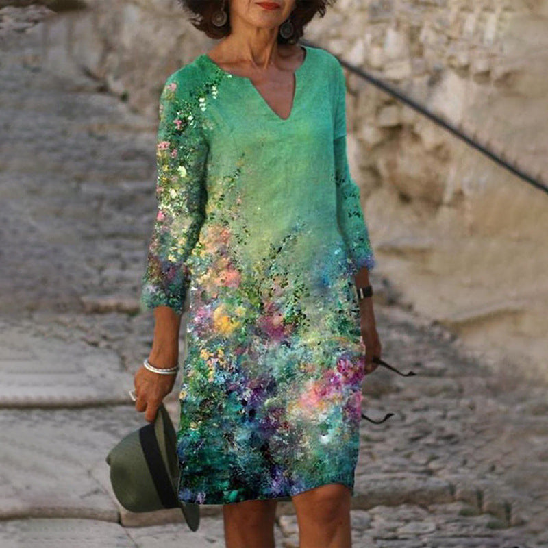 Robe élégante verte pour femme avec imprimé artistique multicolore, manches trois-quarts et look estival