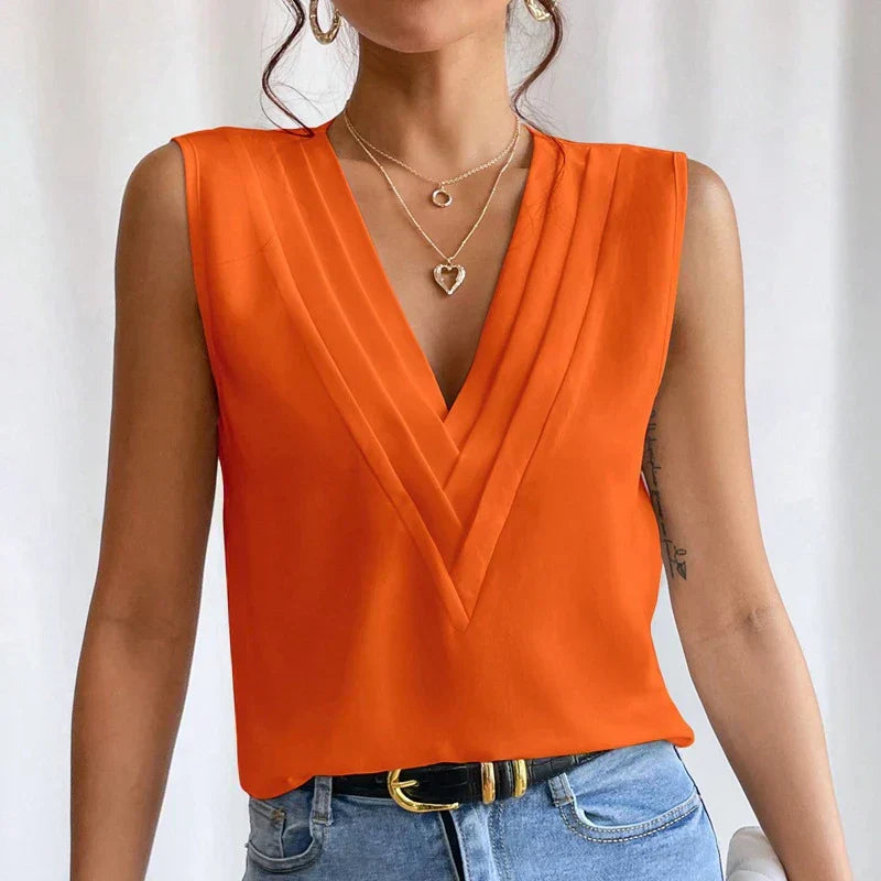 Blouse élégante orange sans manches avec décolleté en V, tissu léger et style coloré